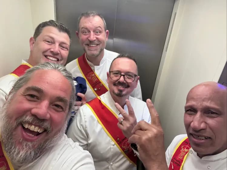 The team dressed for a Disciples of Escoffier event.